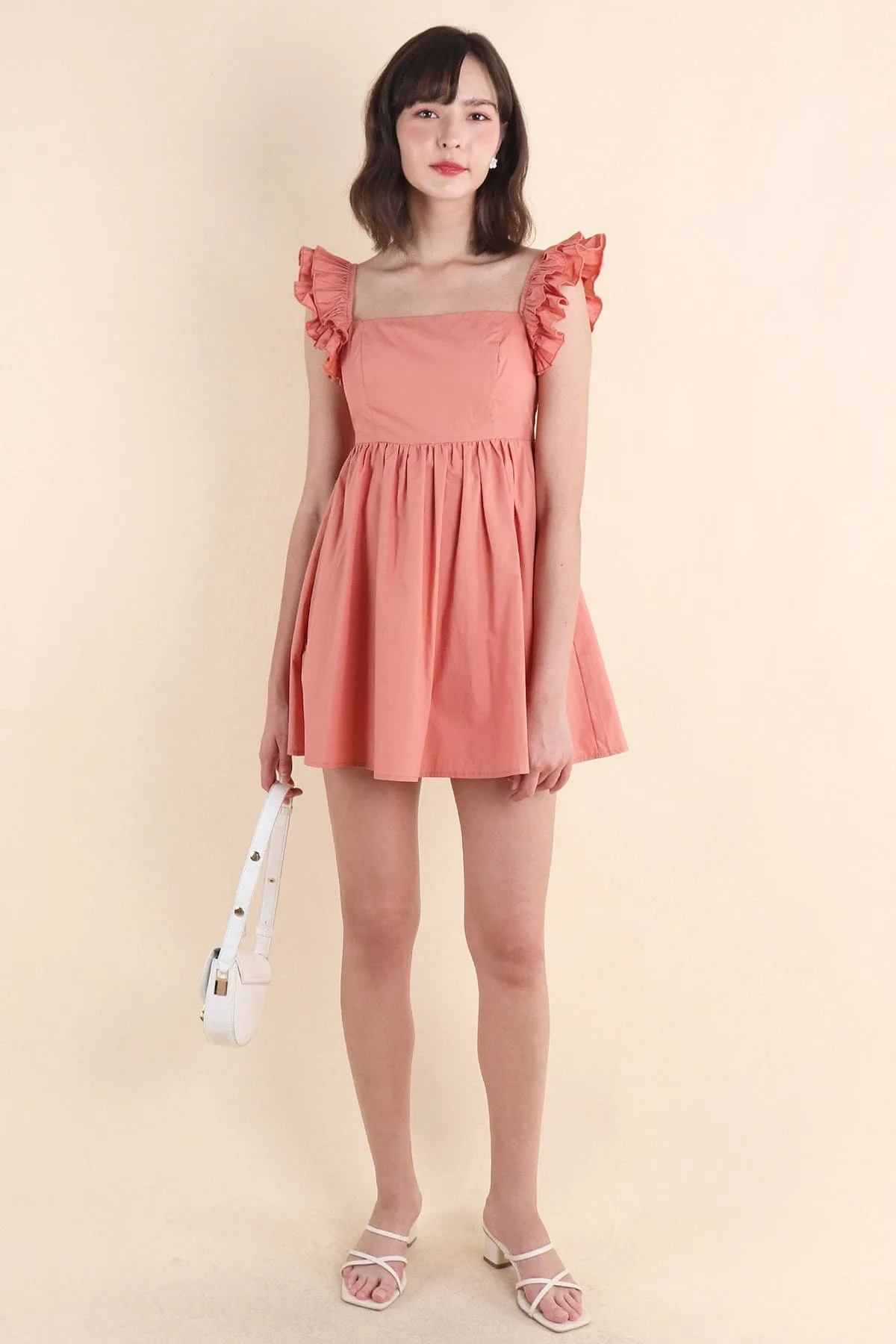 SAMMI ROMPER DRESS IN PEACH TEA